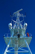 Researcher Hauke Flores watching for birds and seals from the top of Icebreaker Polarstern. ISPOL (ICE Station Polarstern) Expedition 2004/2005 from Alfred Wegener Institute, Bremerhaven, Germany. The...