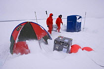 Researchers collecting equipment before incoming storm. ISPOL (ICE Station Polarstern) Expedition 2004/2005 from Alfred Wegener Institute, Bremerhaven, Germany. The Icebreaker Polarstern was drifting...
