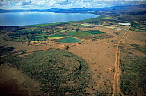 Aerial view of irrigation circle for growing vegetable crops and cultivated flowers alongside Lake Naivasha, Kenya