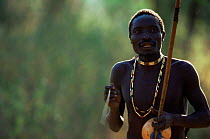Hadzabe tribesman singing and playing musical instrument, Lake Eyasi Basin, Tanzania 2006