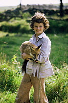 Presenter and cameraman Simon King as a boy holding Red fox in 'The Fox'. 1973