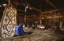 Asmat men in the traditionnal long house "djus", Western Papuasia, Indonesia (Formerly Irian Jaya) 2002 (West Papua).