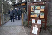 Visitors at RSPB's Loch Garten Capercaillie Watch in spring queueing to access hide, Cairngorms National Park, Scotland, UK 2006