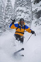 Man skiing the powder at Teton Village Resort, Jackson, Wyoming, USA