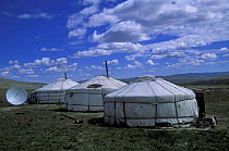Satellite dish outside traditional gers / yurts, Gobi desert, Mongolia, central Asia