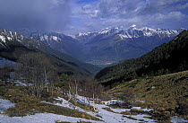 Subalpine zone in May with view to Teberda town in Teberda river valley. Teberdinskiy Zapovednik / Reserve, Caucasus Mountains, Karacheyevo Cherkessiya, Russia