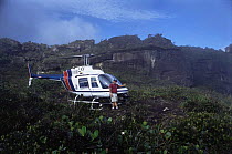 Helicopter on Kukenon, flat top tepuis, southern Venezuela, South America.  On location for BBC Planet Earth series.  November 2005