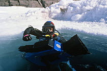 Doug Allan, cameraman, filming with underwater camera for National Geographic, Canadian Arctic