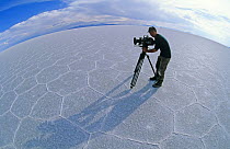 Doug Allan, cameraman, filming for BBC 'Andes to Amazon' on the saltflats of Salar de Uyuni, Bolivia, 1997