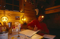 Doug Allan in Kvalvagon hut on location for BBC 'Kingdom of the Ice Bear', April 1996, Svalbard, Norway