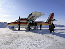 Plane transports crew to location in Belcher Islands near Sanikiluaq, Hudson Bay for BBC Planet Earth Iceworlds programme, Feb 2006.