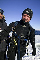 Camerman Doug Allan on location for Planet Earth - Iceworlds, March 2006. Filming under the ice. Belcher Islands, near Sanikiluaq, Hudson Bay, Canada. Temperature was around -20C.
