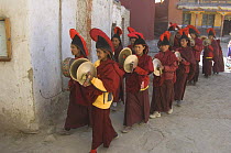 Procession of Nepalese monks, leaving the Gompa for final ceremony inside the village of Lo-Manthang, Upper Mustang, Nepal