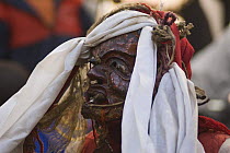 Close-up of Nepalese monk with mask, dressed as a Demon during 'Duk chu' festival, Lo-Manthang, Upper Mustang, Nepal