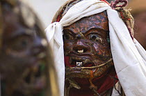 Close-up of Nepalese monk wearing face mask, dressed as a Demon, during 'Duk chu' festival, Lo-Manthang, Upper Mustang, Nepal
