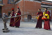 Nepalese monks playing the 'Lawa' (long trumpet) and 'Geling' (short trumpet) during 'Duk chu' festival, Chhode Gompa of Lo-Manthang, Upper Mustang, Nepal