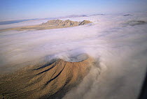 Aerial view of ground fog swirling round Crater Caravajales, Biosphere Reserve of Pinacate and Gran Desierto Altar, Sonora, Mexico