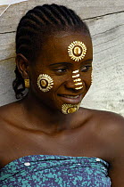 Traditional face painting done by the local women of Nosy Komba Island. Northern MADAGASCAR 2005