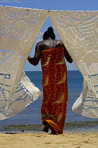 Traditional 'lace' embroidered tablecloths made by the local women on Nosy Komba Island. Northern MADAGASCAR 2005