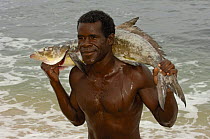 Vezo fisherman bringing catch ashore. Lavanono  fishing village, south coast of MADAGASCAR 2005