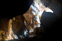 Donini cave with explorer, Sardinia, Italy