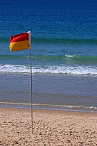 Life guard flag on beach, Mooloolaba, Sunshine Coast, Queensland, Australia