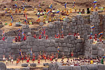 Indian men and women performing an Inca initiation ceremony, Warachikuy festival, Archaeological Park of Sacsayhuaman, Cusco, Peru 2006.