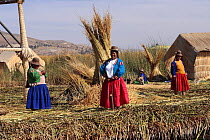 Indian women on Uros Floating reed Islands, Lake Titicaca, Peru 2006.