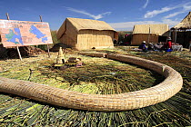 Huts and gathering site on Uros Floating reed Islands, Lake Titicaca, Peru 2006.