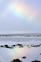 Arctic Rainbow over sea, Varangerfjord, Arctic Norway