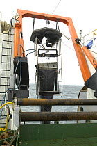 Launching multisampler trawl from research ship, Barents sea, Northern Europe