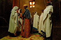 Orthodox christian priest preparing for a christening at Lalibela, North Ethiopia, 2006