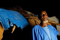 Fulani man outside hut, South Mauritania, West Africa, 2005