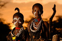 Two young Hamer children display their traditional face paints and costume, Omo valley, Ethiopia, 2006