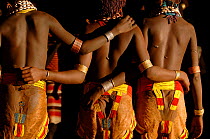 Three teenage Hamer girls showing their scars (inflicted by their brothers and considered a sign of beauty and bravery) Omo valley, Ethiopia, 2006