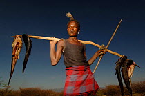 Hamer man returns from fishing with catfish, Omo valley, Ethiopia, 2006
