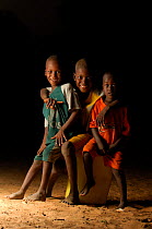 Three Fulani children laughing, South Mauretania, West Africa, 2005