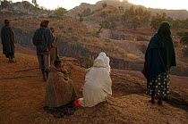 Worshippers praying at dawn outside St George's Church, Lalibela, North Ethiopia, St George's church is carved from a single block of rock, 2006