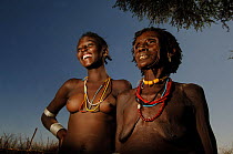 Old women of the Tsemai tribe with her granddaughter, Omo valley, Ethiopia, 2006