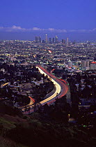Los Angeles city at dusk with traffic on Highway, California, USA, 2006