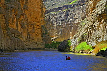 People canoeing on Rio Grande river, Boquillas Canyon, Big Bend National Park, Texas, USA