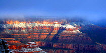 Grand Canyon at first light with mist. Different sedimentary layers obvious, Arizona, USA