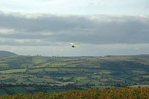 Hang Glider over the Onny Valley viewed from Long Mynd, Area of Outstanding Natural Beauty, Shropshire Hills, UK 2006