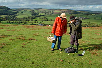 Members of the Shropshire Fungi Group examining fungi, Hopesay Hill (National Trust) Shropshire Hills - an Area of Outstanding Naturall Beauty, UK 2006