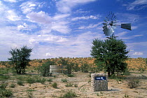 Wind driven waterhole pump in the Kalahari desert, Kgalagadi Transfrontier Park, South Africa