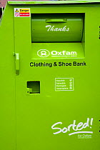 Oxfam Clothing and shoe recycling unit in supermarket carpark, Shrewsbury, Shropshire, UK
