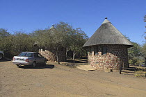 Thatched huts at tourist camp in Kruger National Park, South Africa