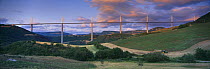The Viaduct of Millau spanning the Gorge du Tarn with tractor working in the fields, Aveyron, Midi-Pyrénées, France