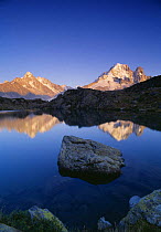 The Dru and Arguille de Argentiere reflected in the Lac des Cheserys, Massif du Mont Blanc, nr Chamonix, Savoie, France
