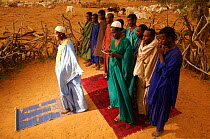 Fulani men at 'outdoors' mosque built in the desert, Mauritania, West Africa, 2005